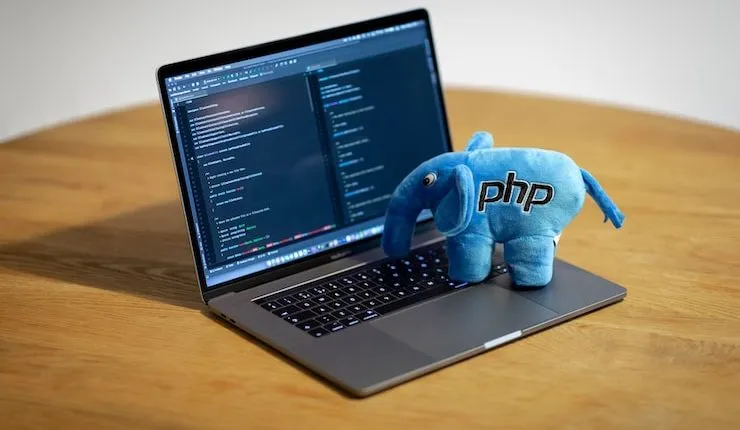 blue elephant figurine on macbook pro